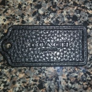 Black leather Coach tag